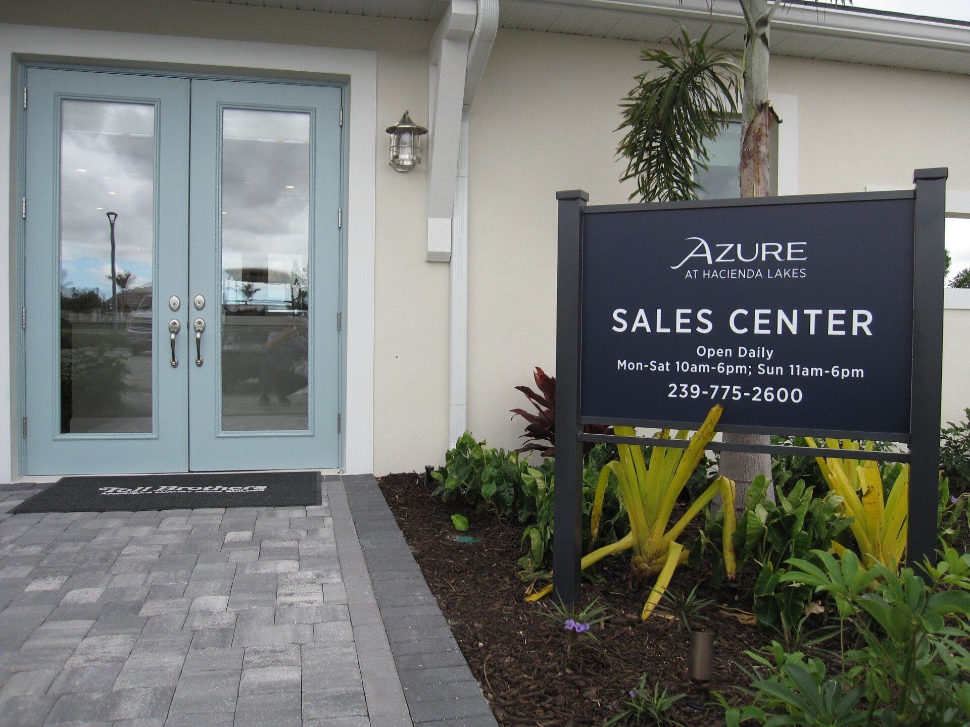 Azure sales center sign in front of a house