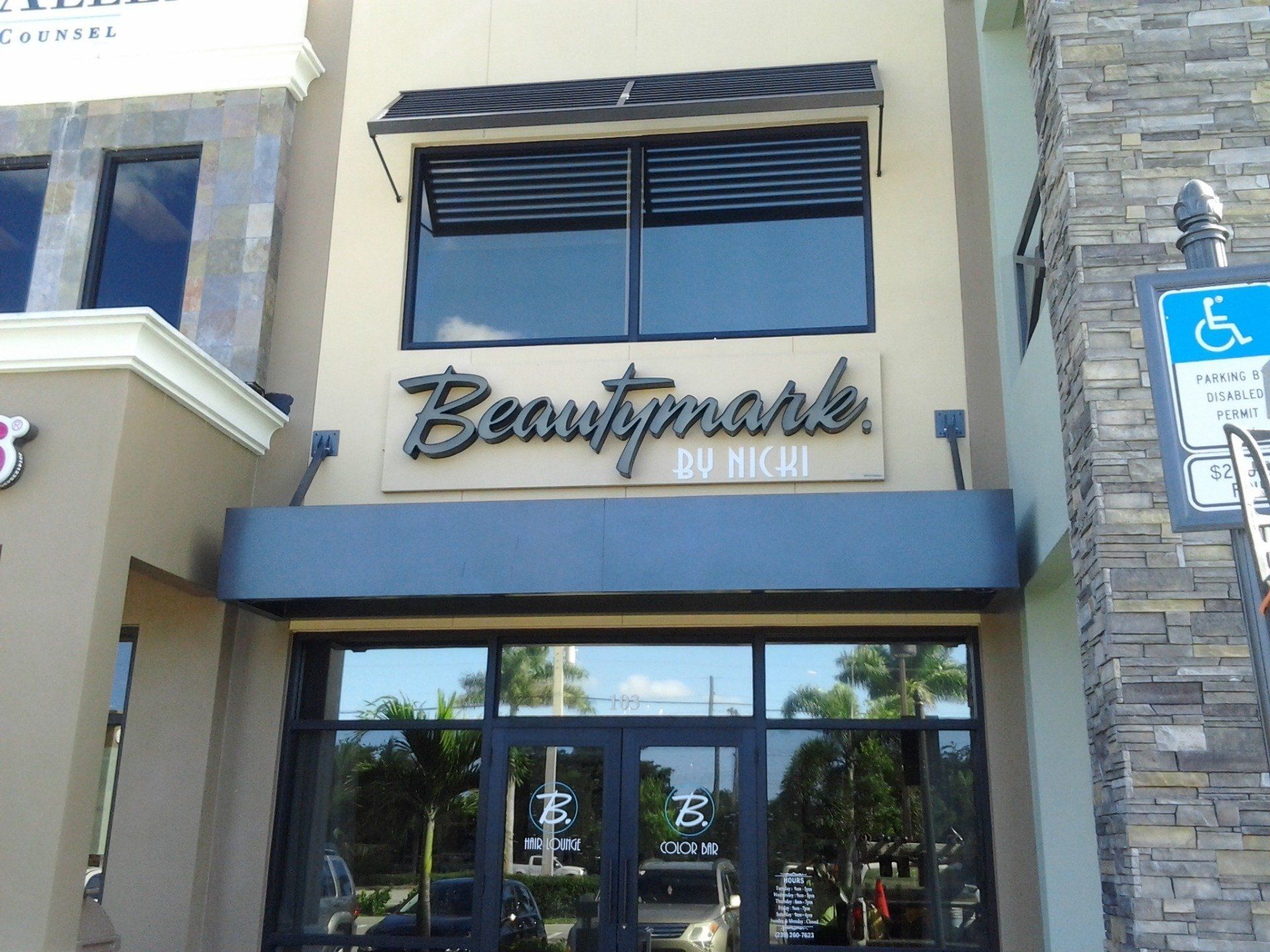 A building with a sign that says beautymark on it