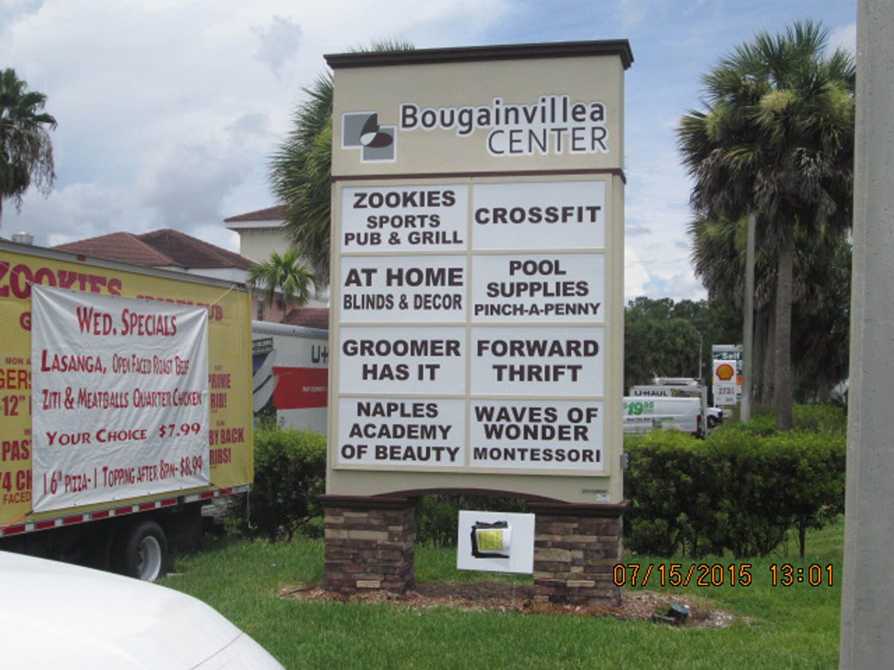 A sign that says ' bougainvillea center ' on it