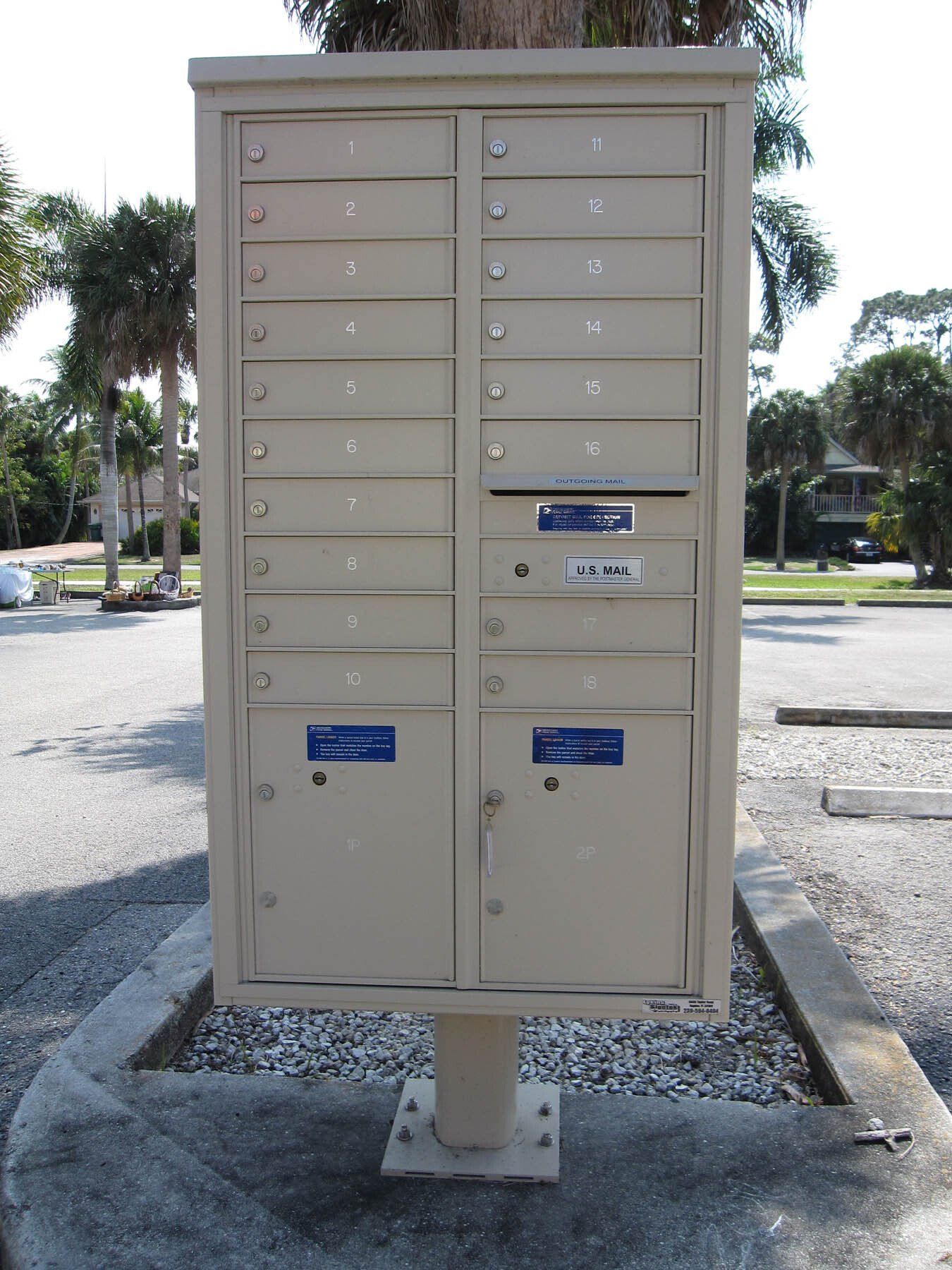 A mailbox with a blue sticker on it that says pilots