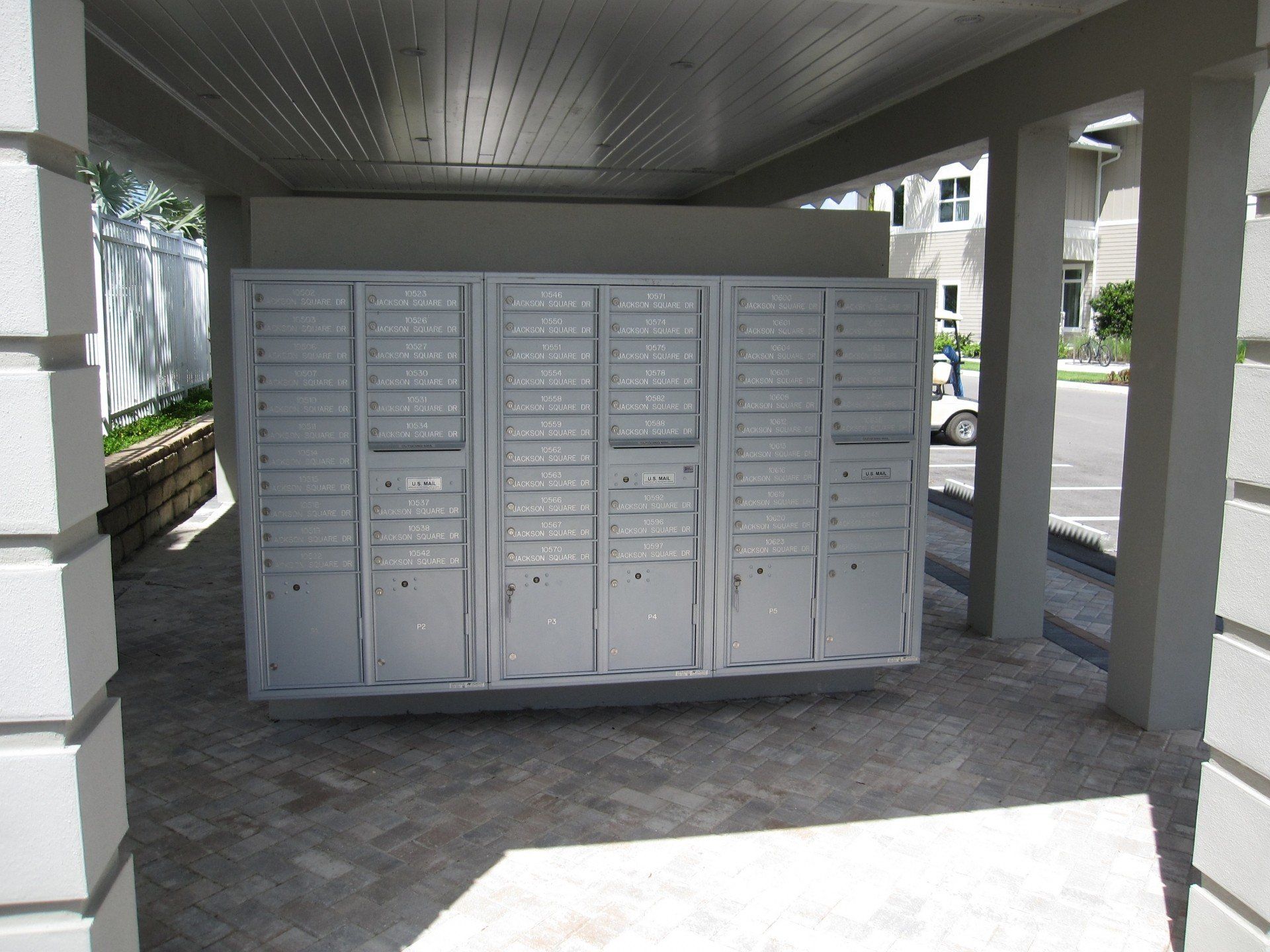 A row of mailboxes under a covered walkway