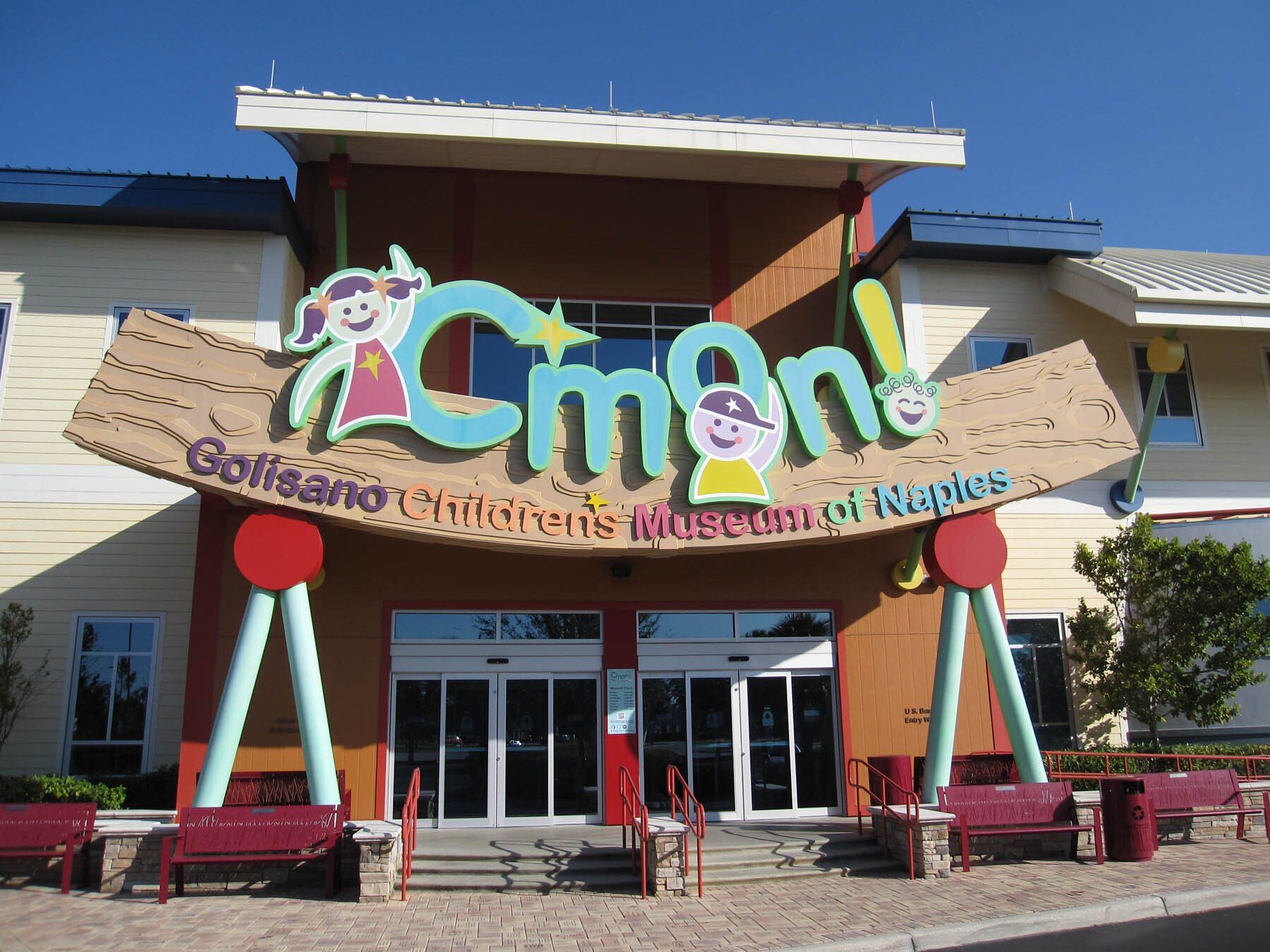 A building with a sign that says ' cman ' on it