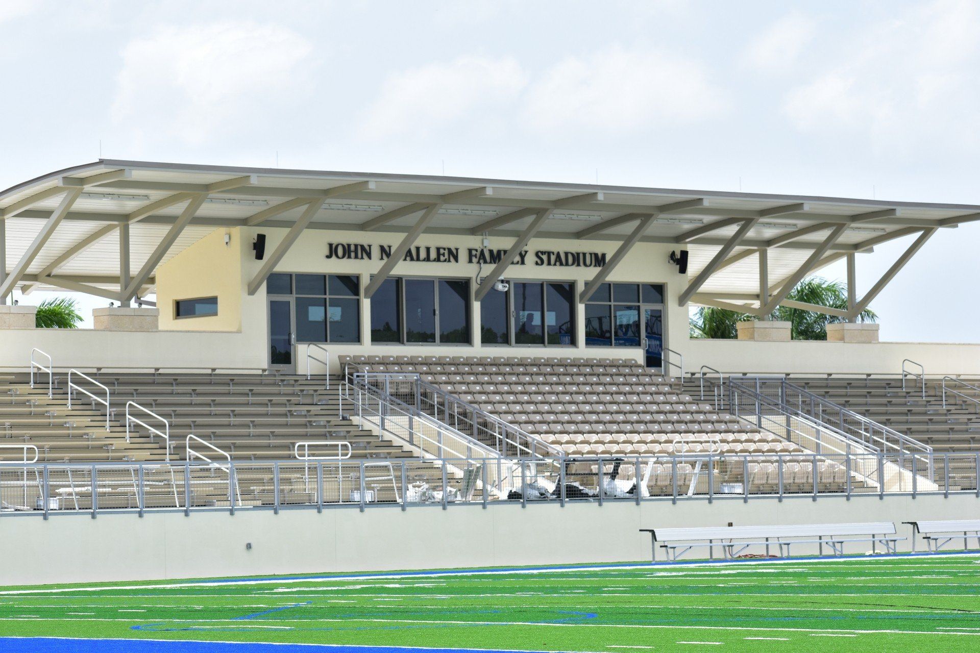 A stadium with bleachers and a sign that says john n allen family stadium