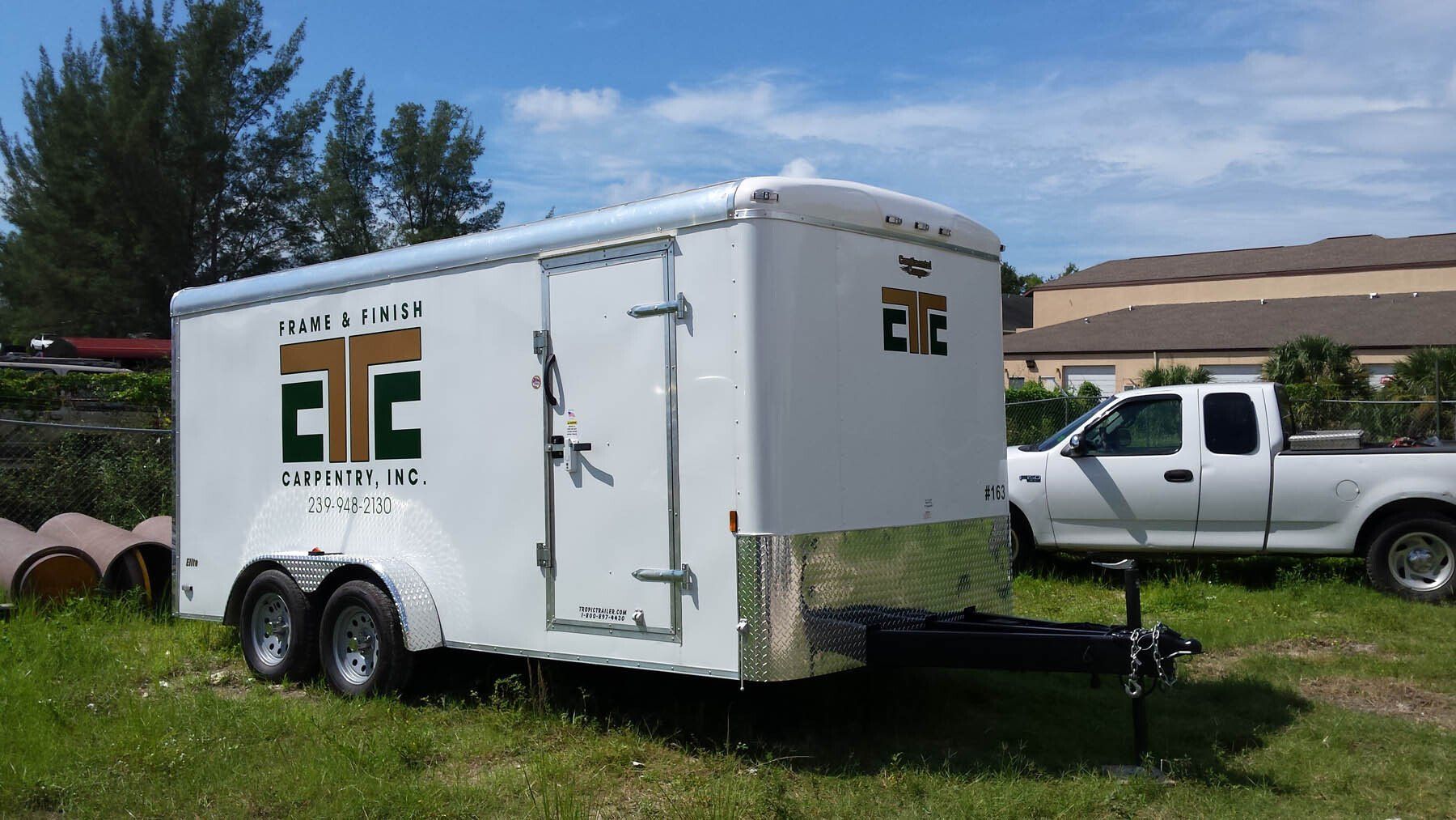 A white trailer with the letters aec on it