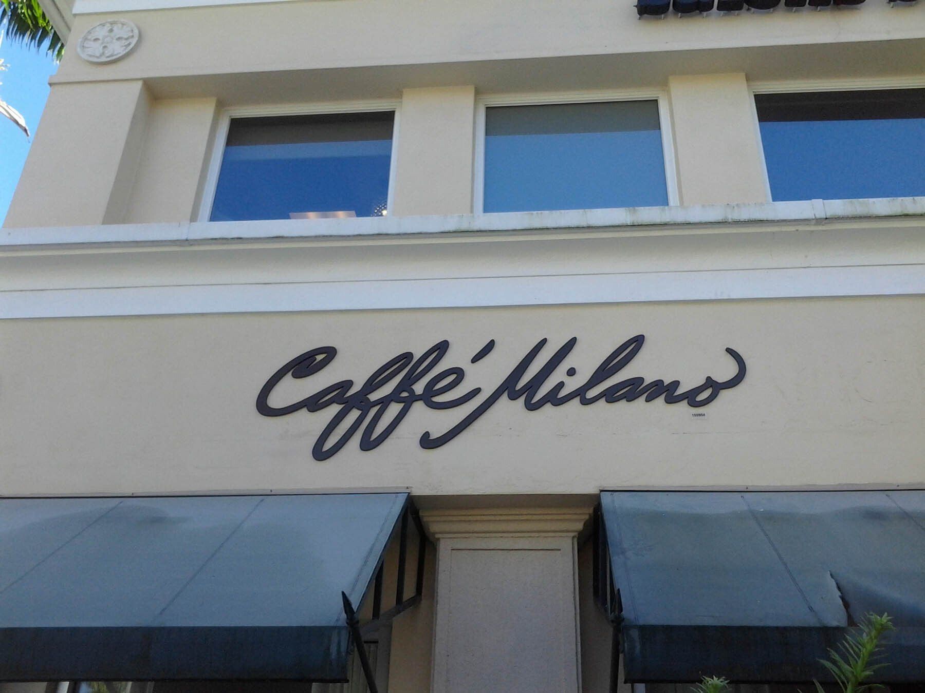 A building with a sign that says caffe milano