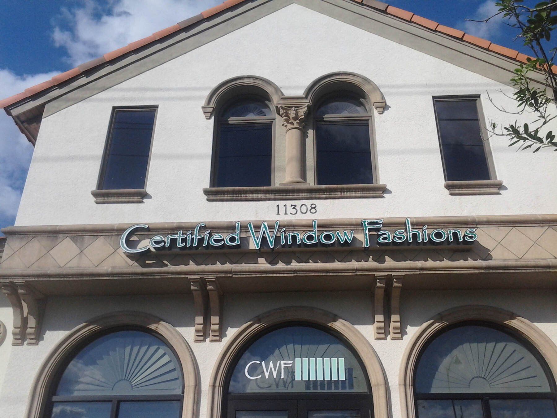 A building with a sign that says certified window fashions