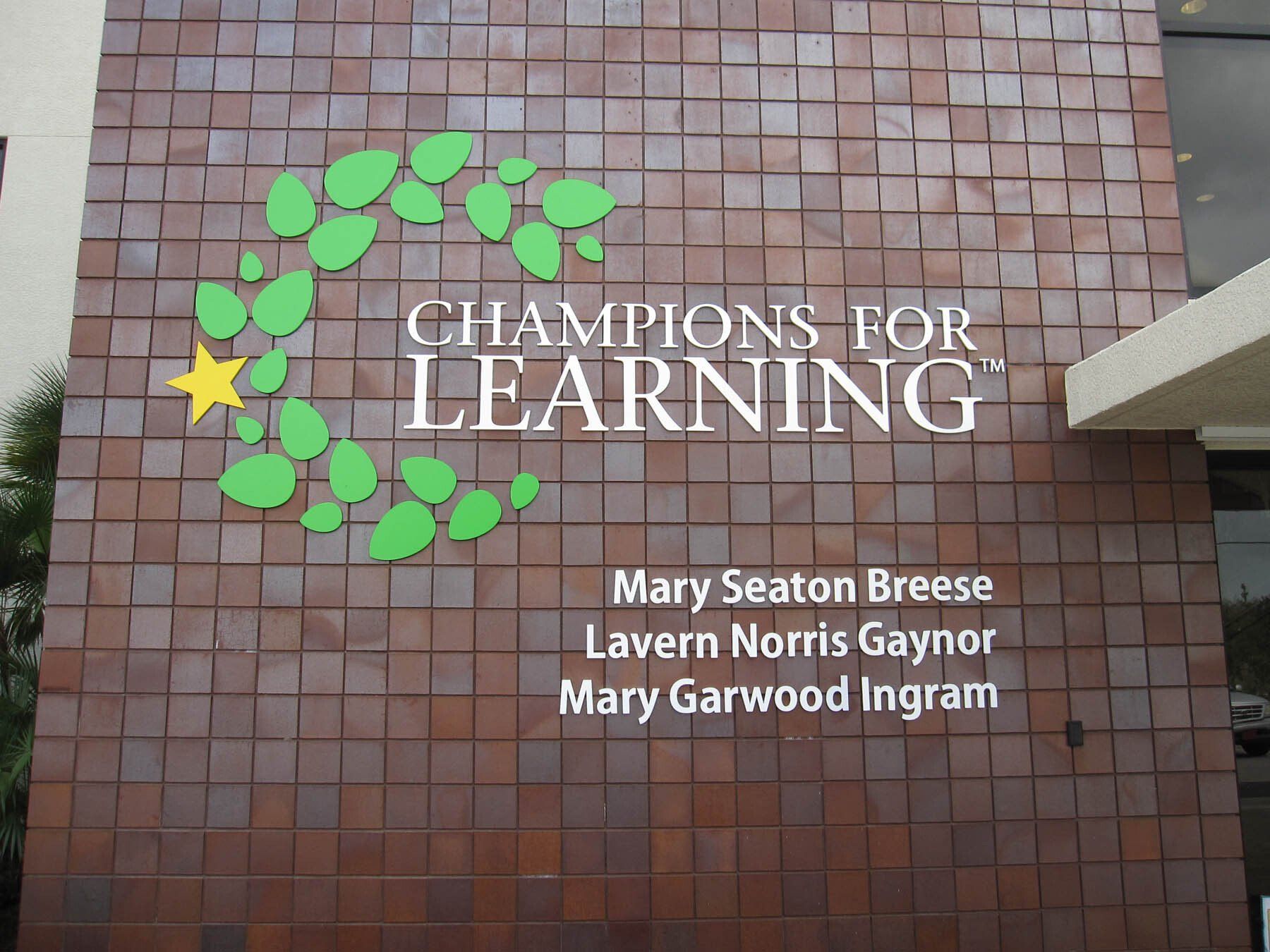 A sign that says champions for learning on it