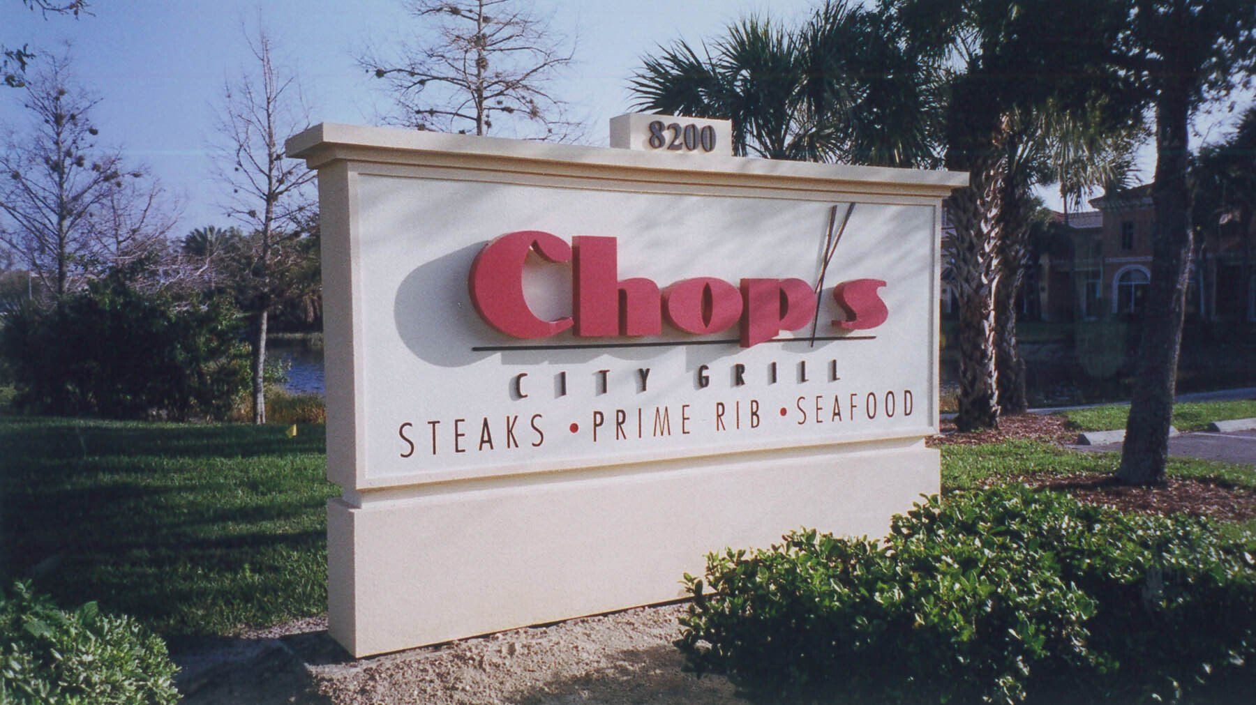 A sign for chop 's city grill stores prime rib seafood