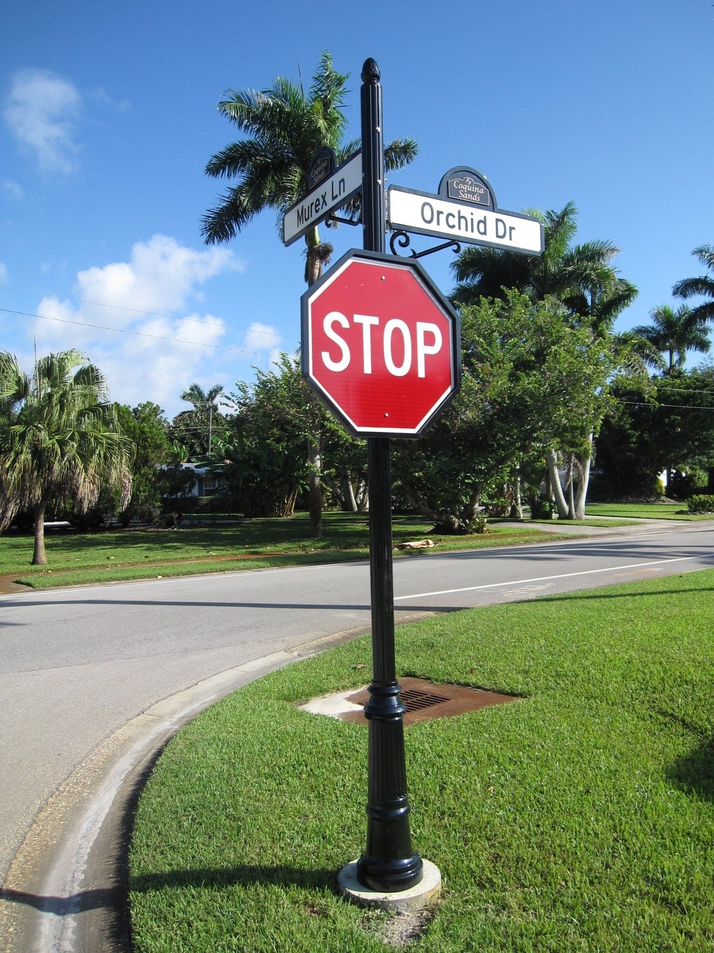 A stop sign in front of orchid drive