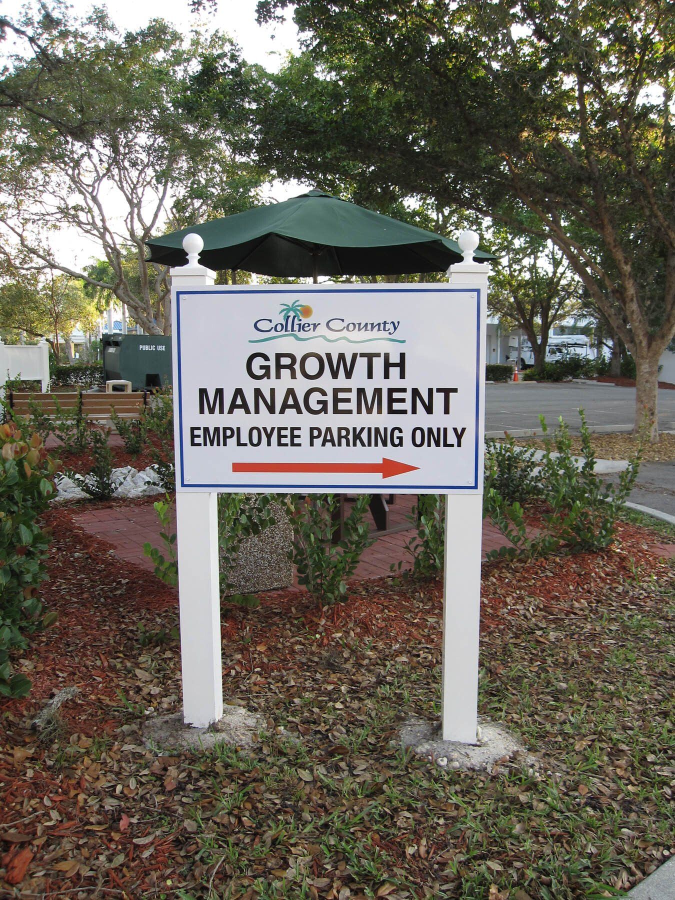 A sign that says growth management employee parking only