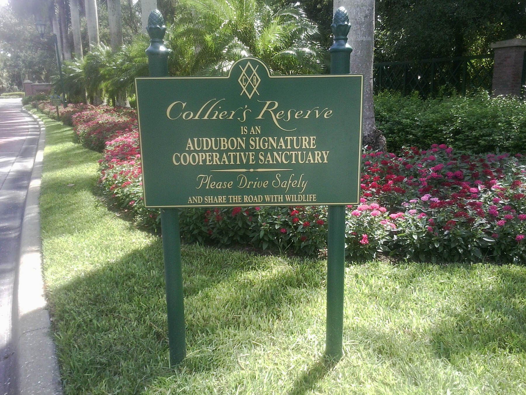 A green sign that says collier 's reserve on it