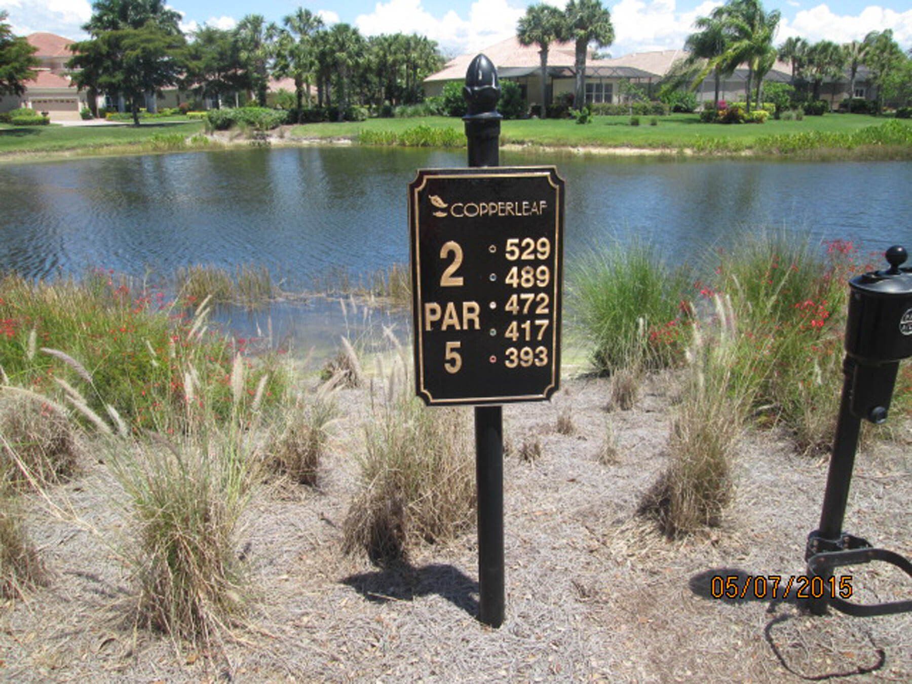 A golf course with a sign that says par 2 on it
