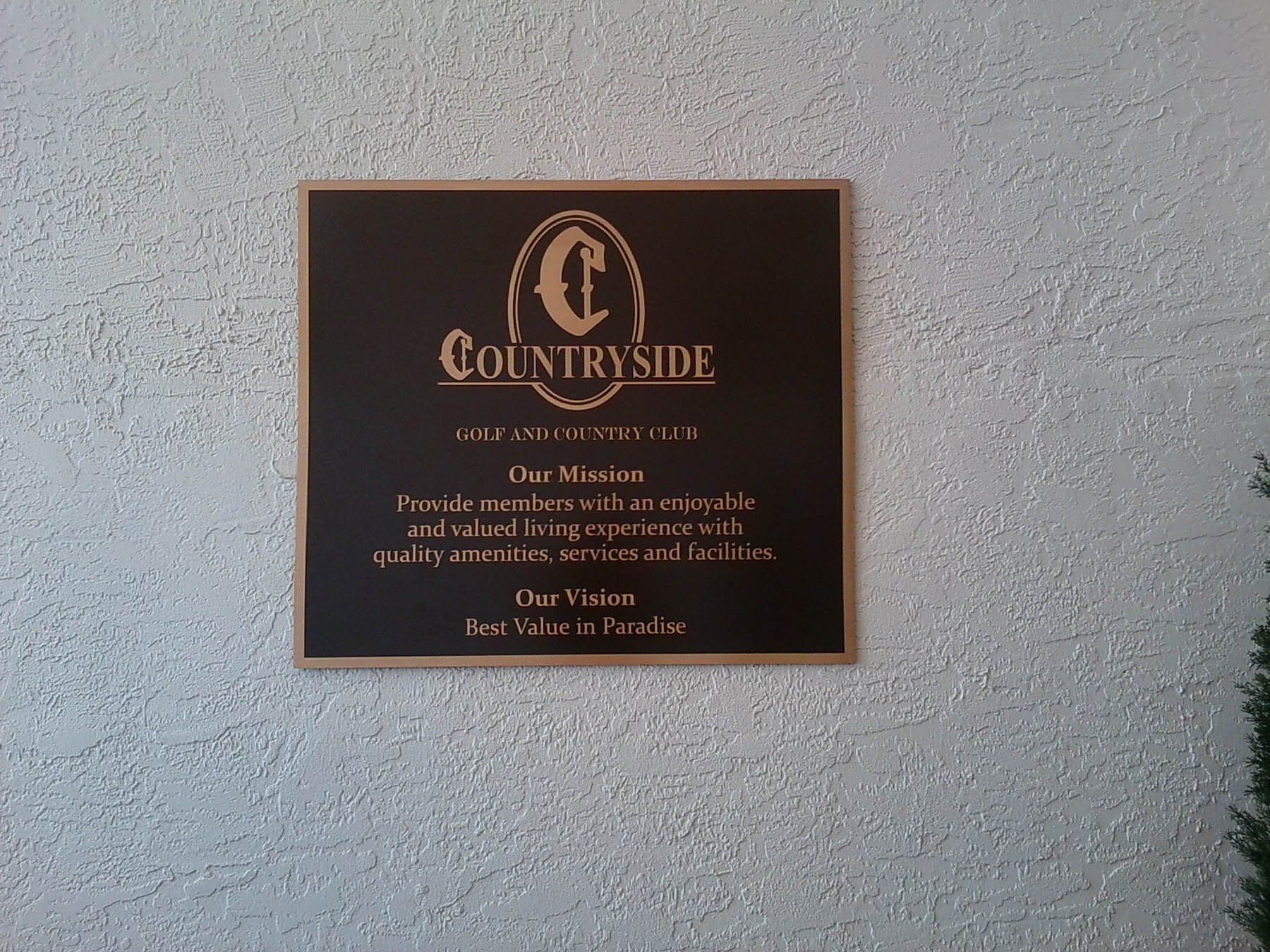 A sign on a wall that says countryside on it