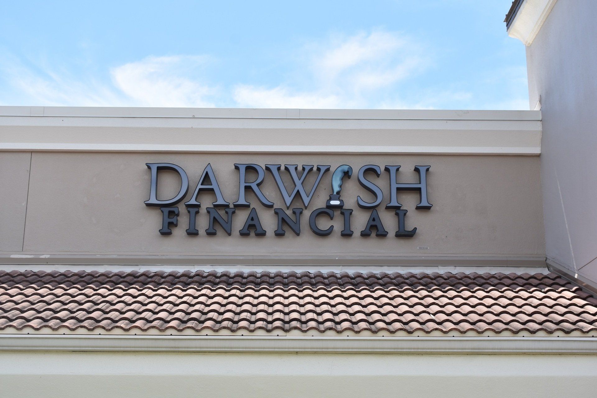 A darwash financial sign is on the side of a building.