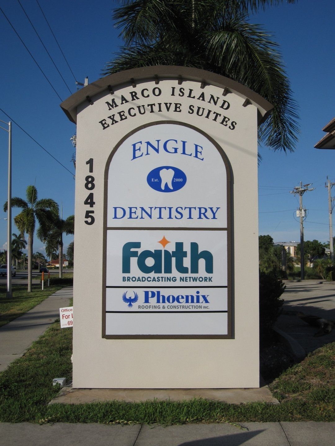 A sign for marco island executive suites engle dentistry and faith phoenix