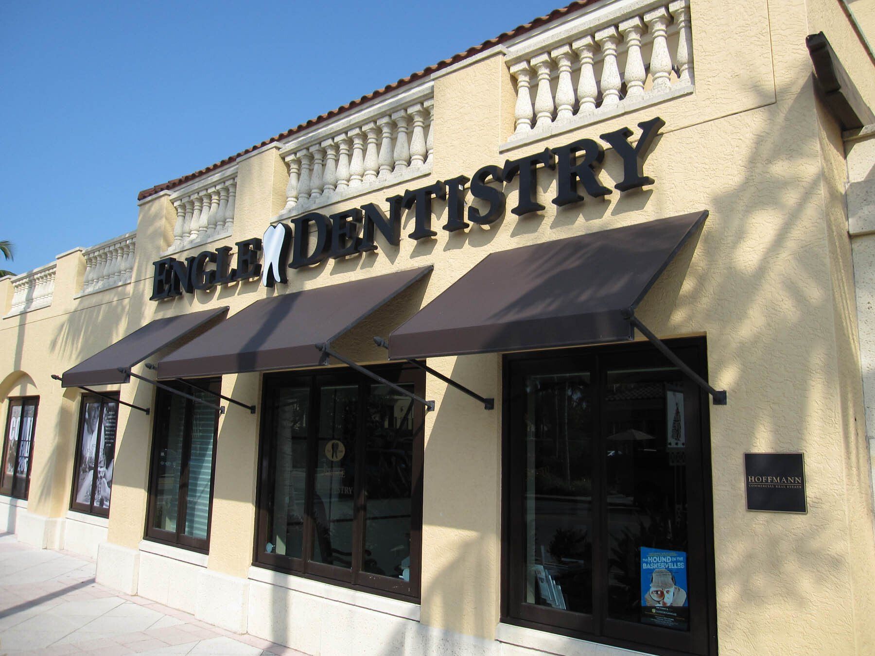 A building with a sign that says dental on it