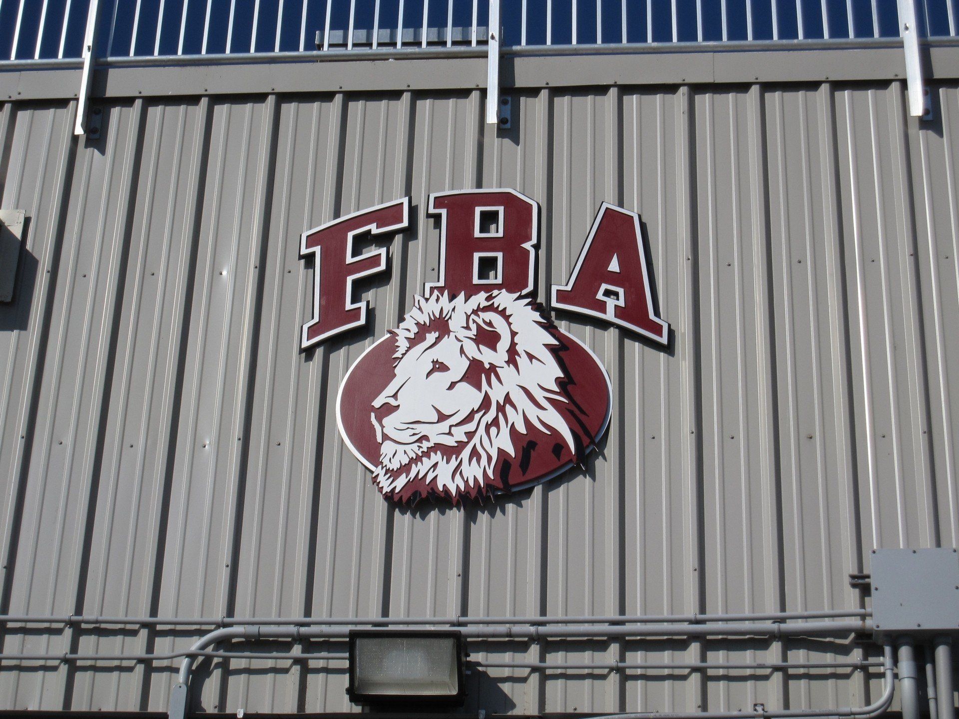 A sign on the side of a building that says fba