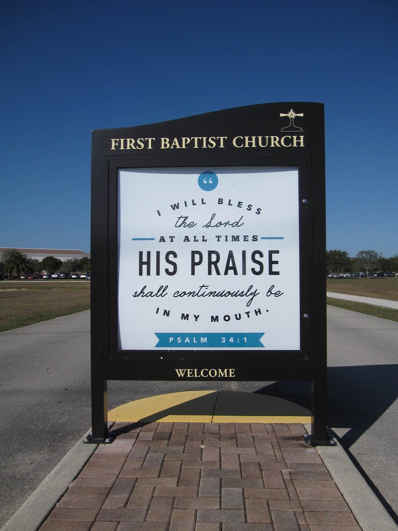 A sign that says first baptist church on it