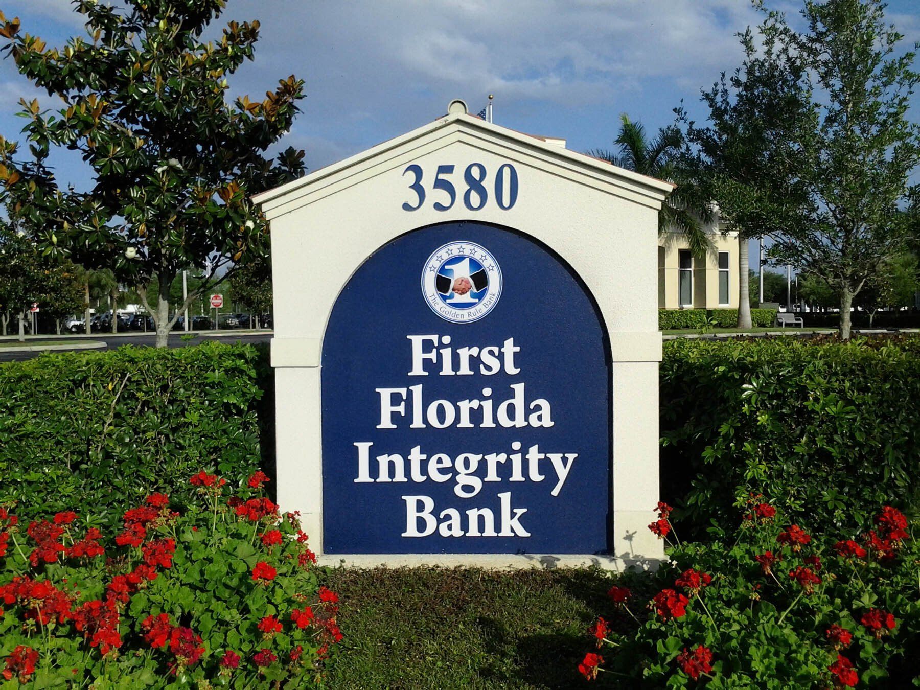 A blue and white sign for first florida integrity bank