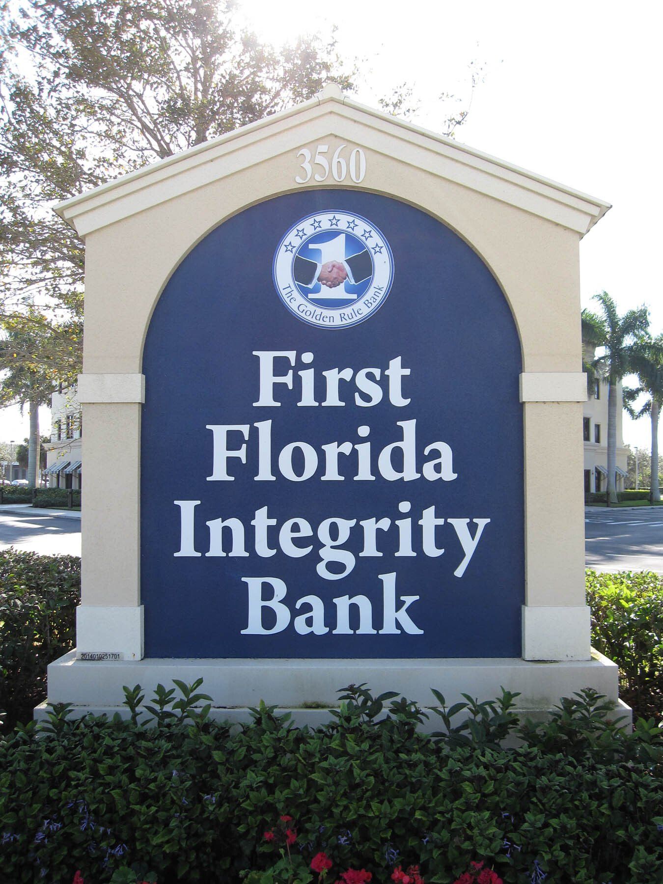 A blue and white sign for first florida integrity bank