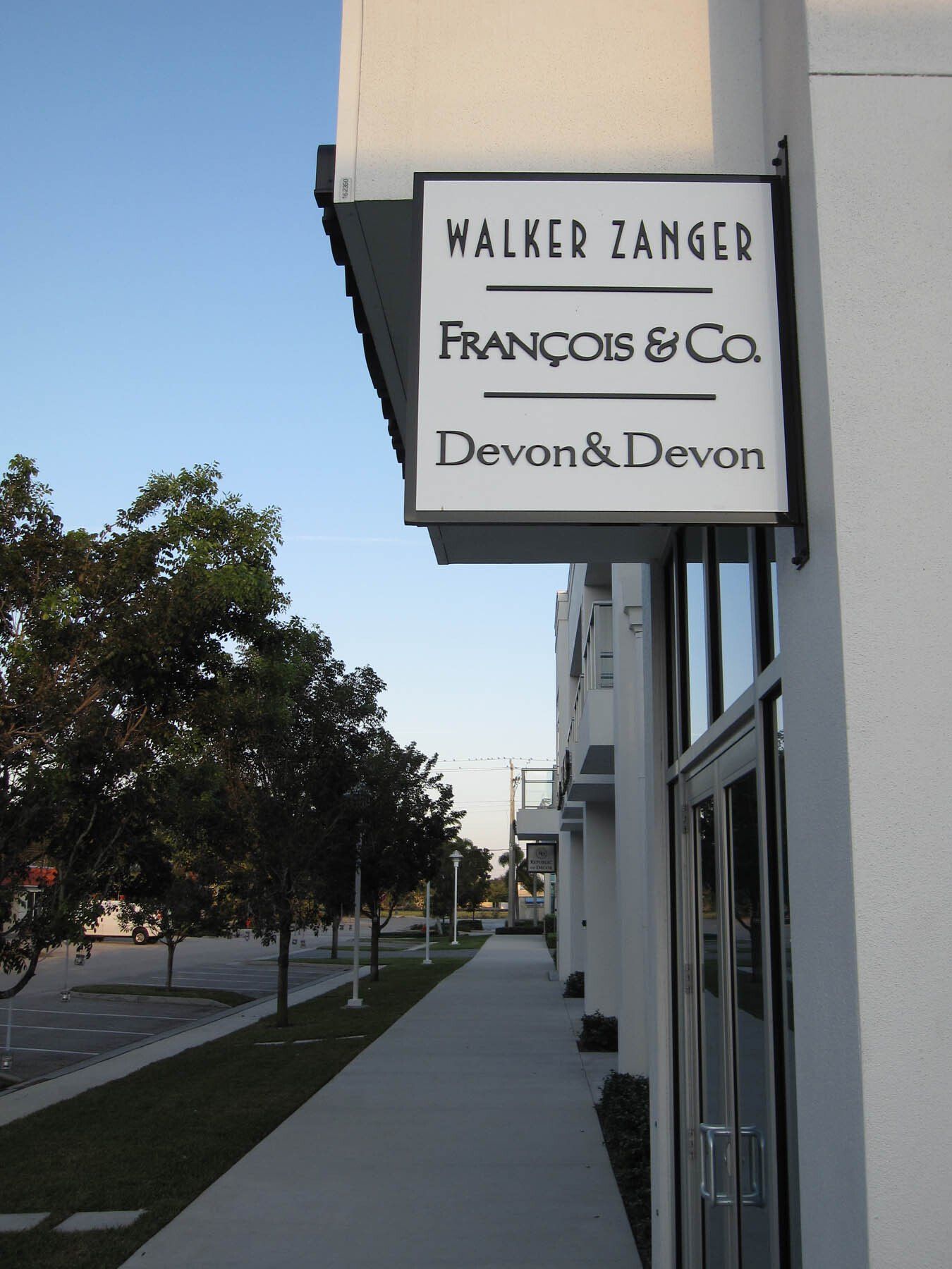 A sign for walker zanger francois & co. devon & devon
