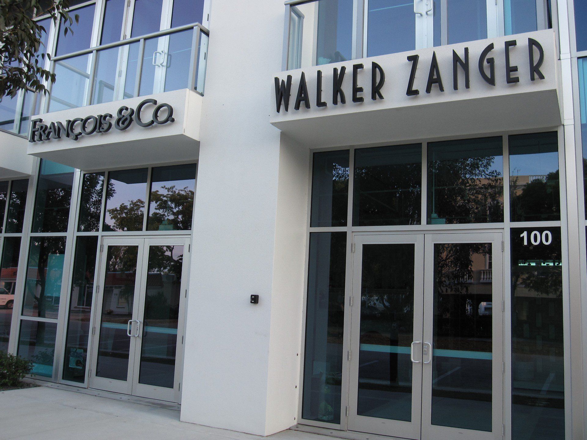 A white building with walker zanger written on it