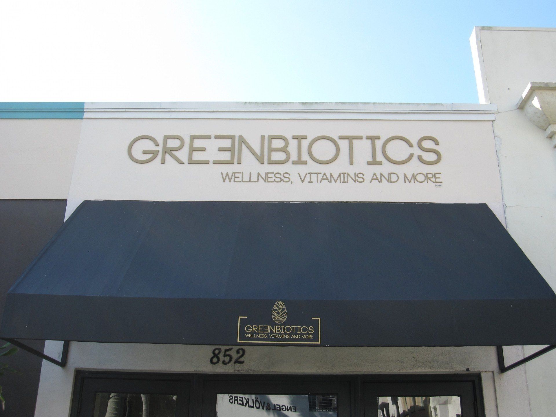 A sign for greenbiotics wellness vitamins and more