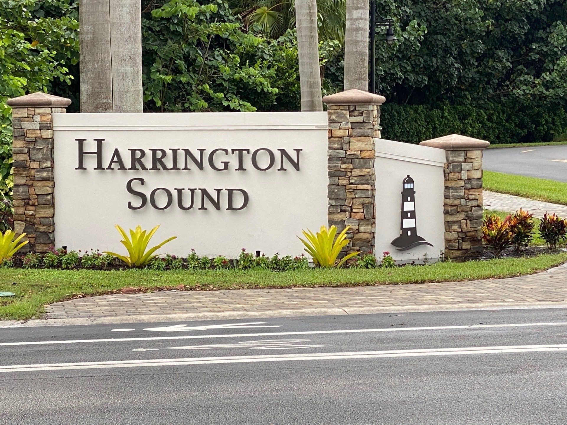 A sign for harrington sound has a lighthouse on it