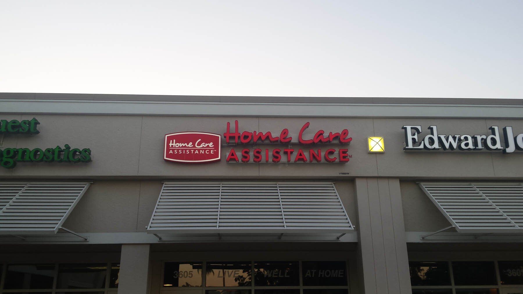 A building with a sign that says `` home care assistance '' on it.
