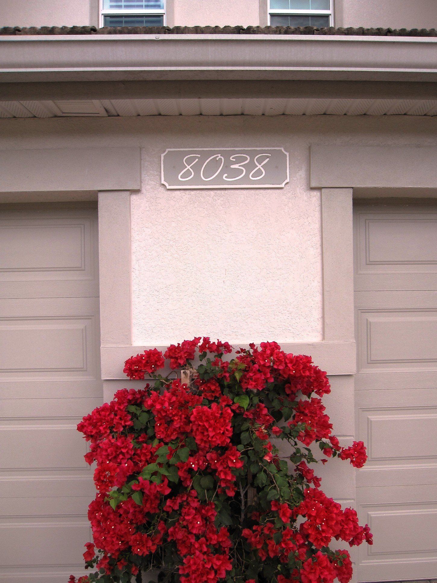 A house with a sign that says ' 8038 ' on it
