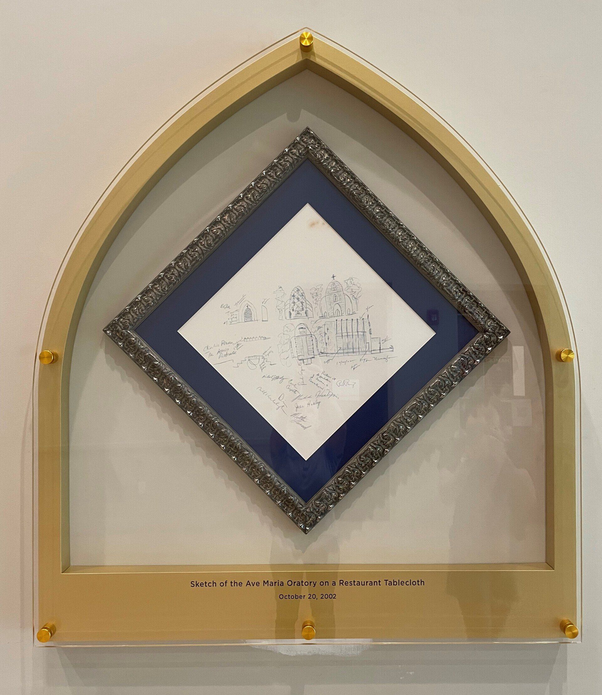 A diamond shaped picture in a gold frame