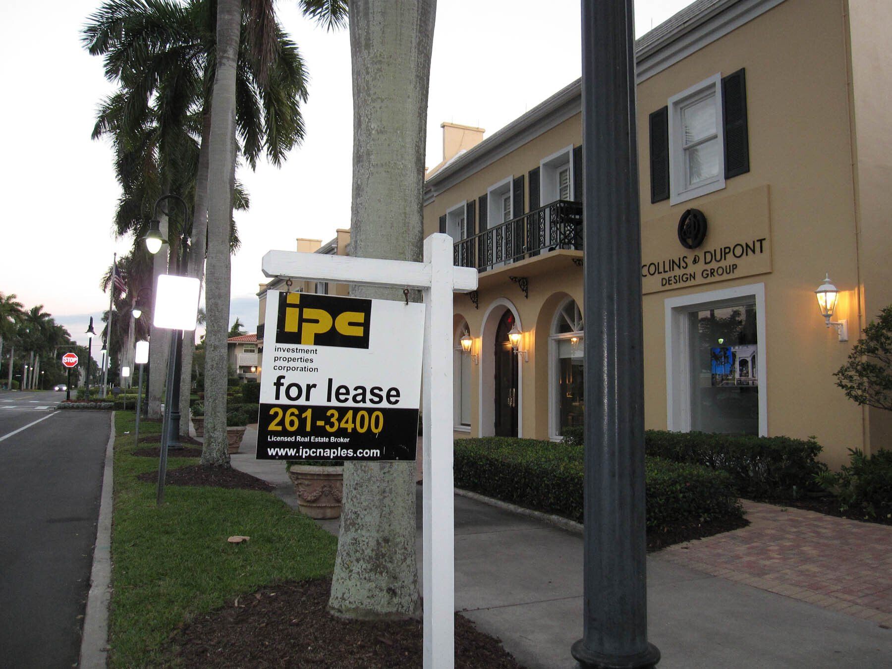 An ipc for lease sign in front of a building