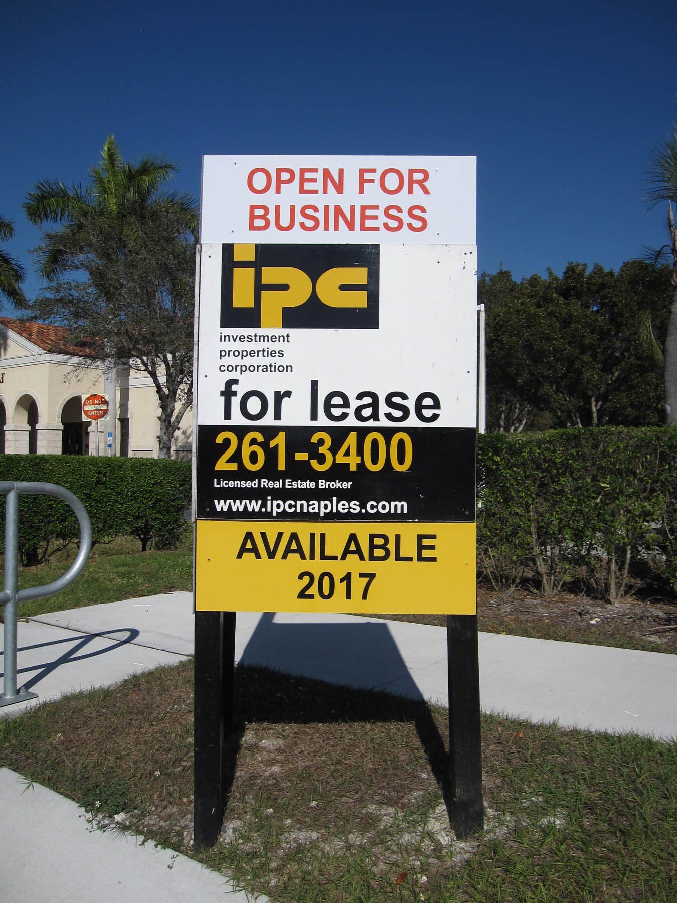 A sign that says open for business on it