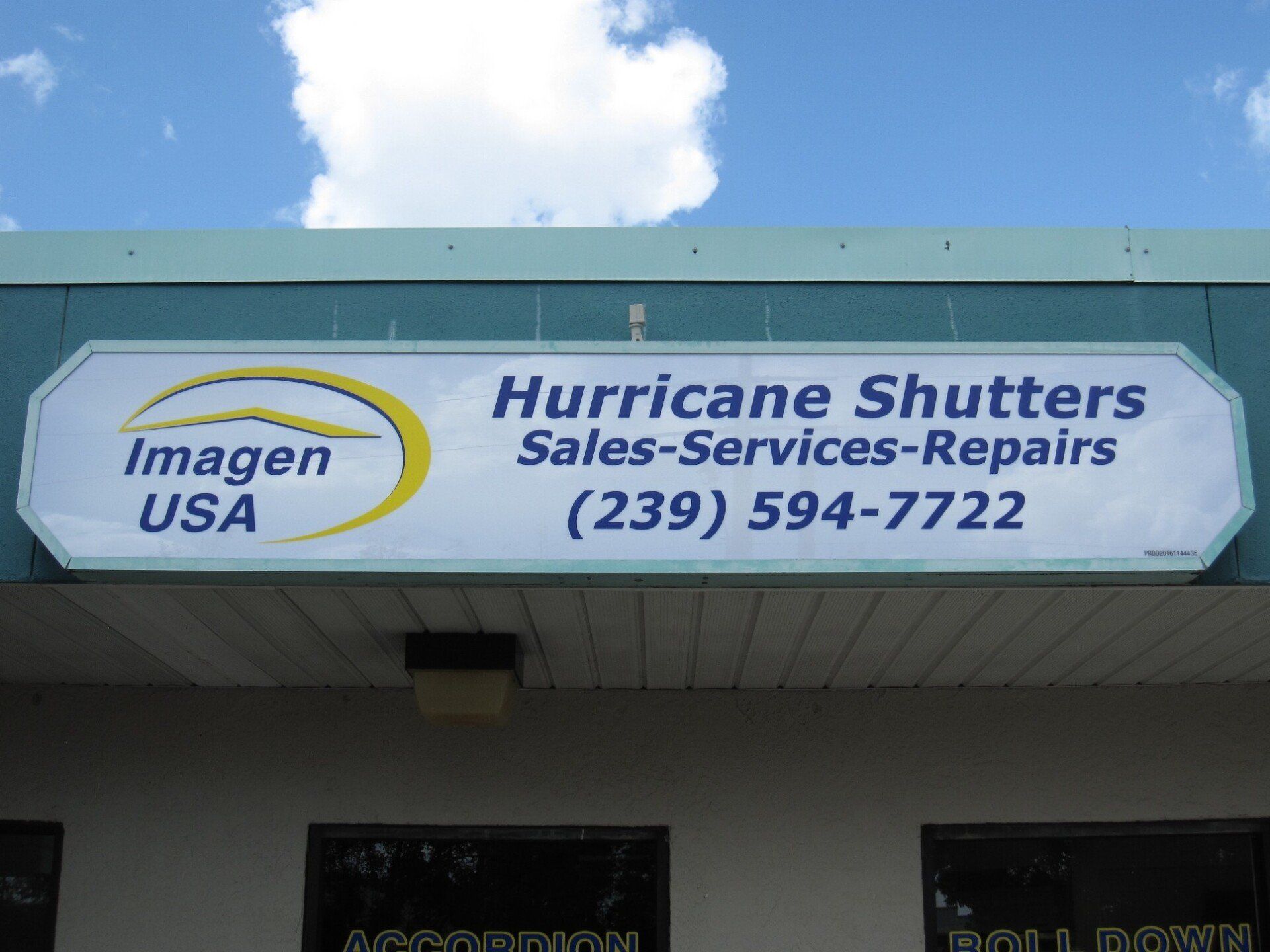 A sign for hurricane shutters sales services repairs
