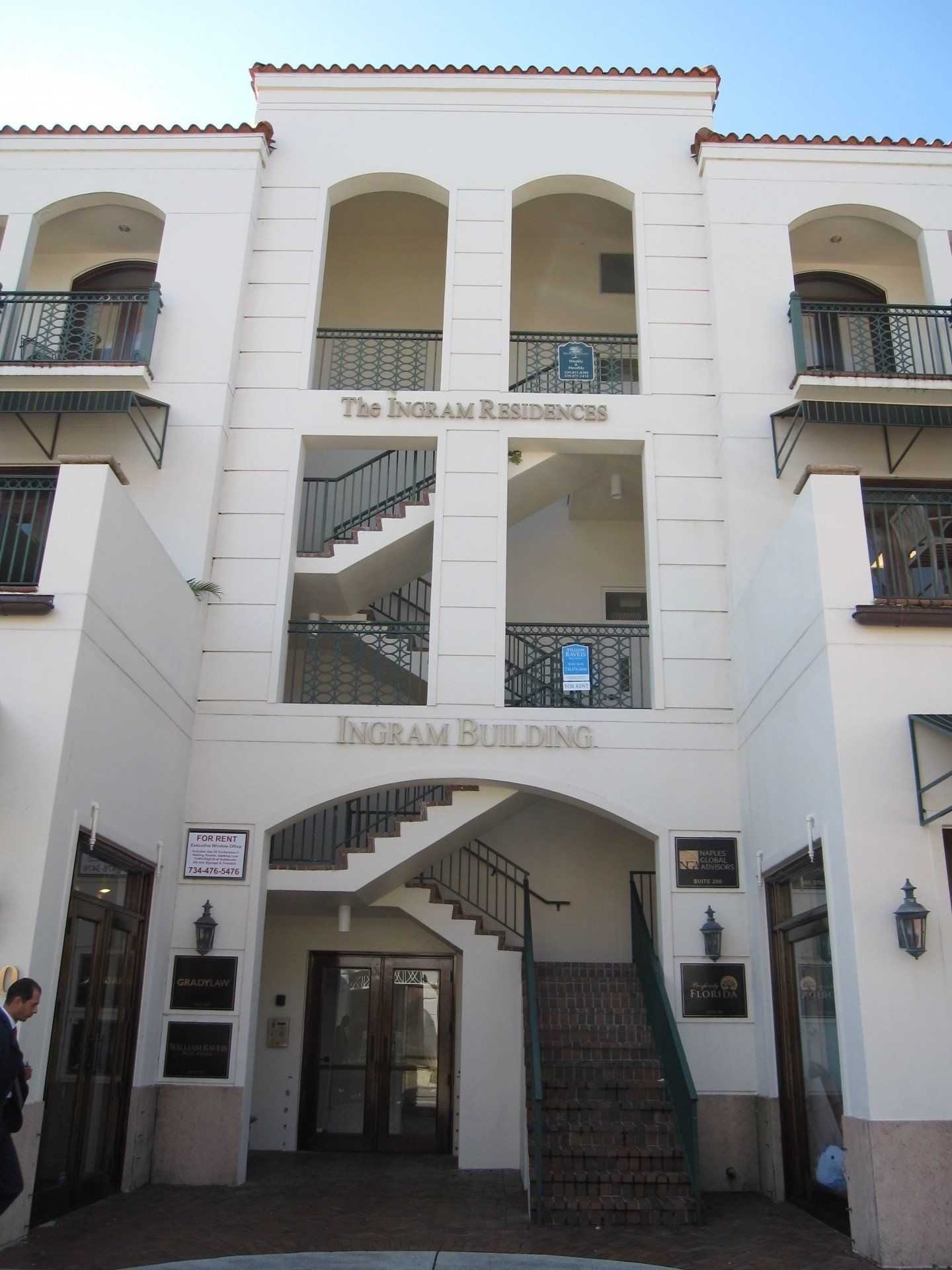 A white building with the word ingram building on it