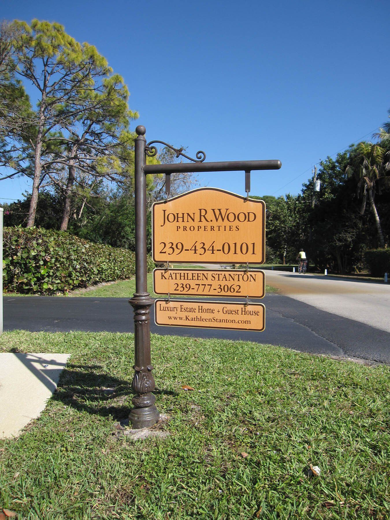 A sign that says john r. wind properties on it