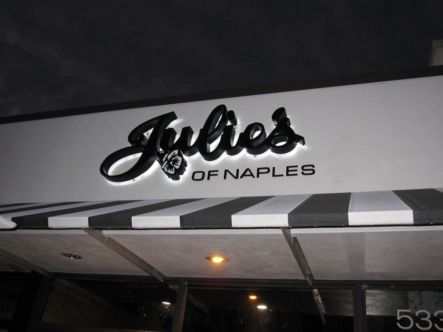 A black and white sign for julies of naples