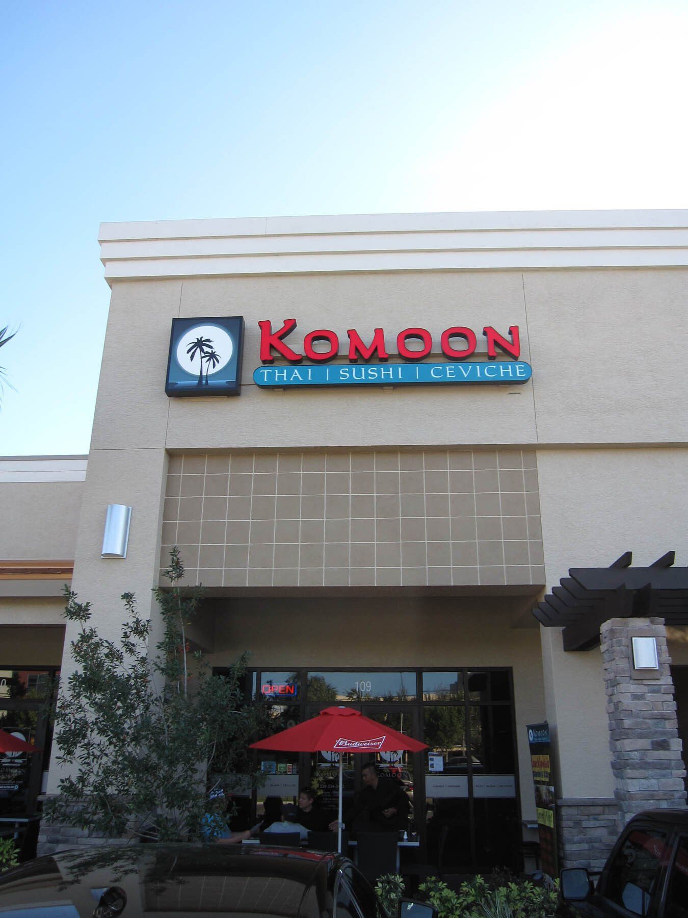 The front of a restaurant called komoon that serves sushi
