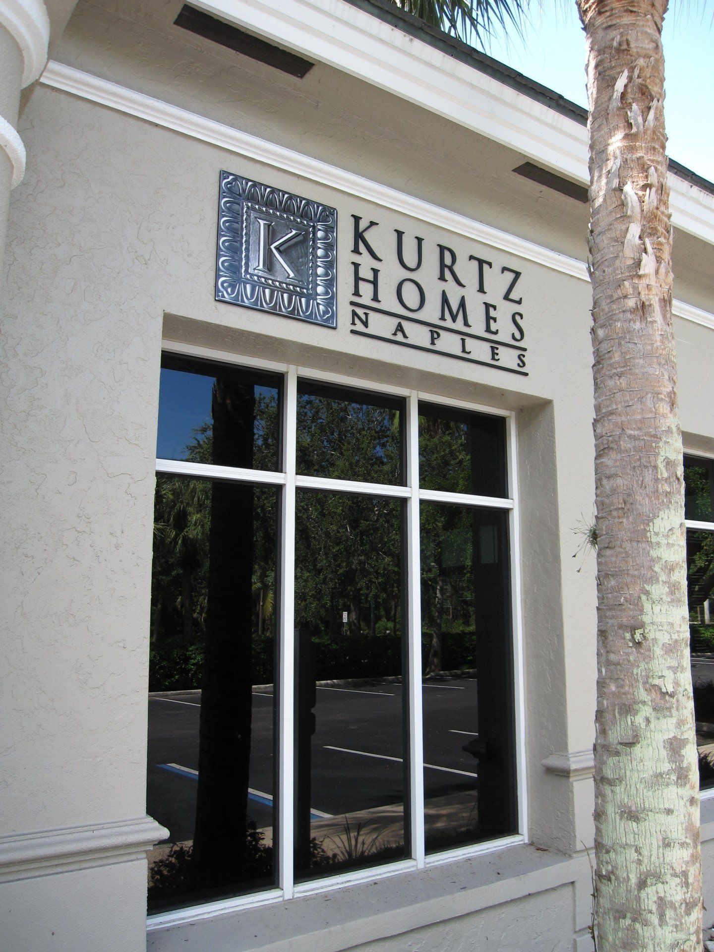 A building with a sign that says kurtz homes on it