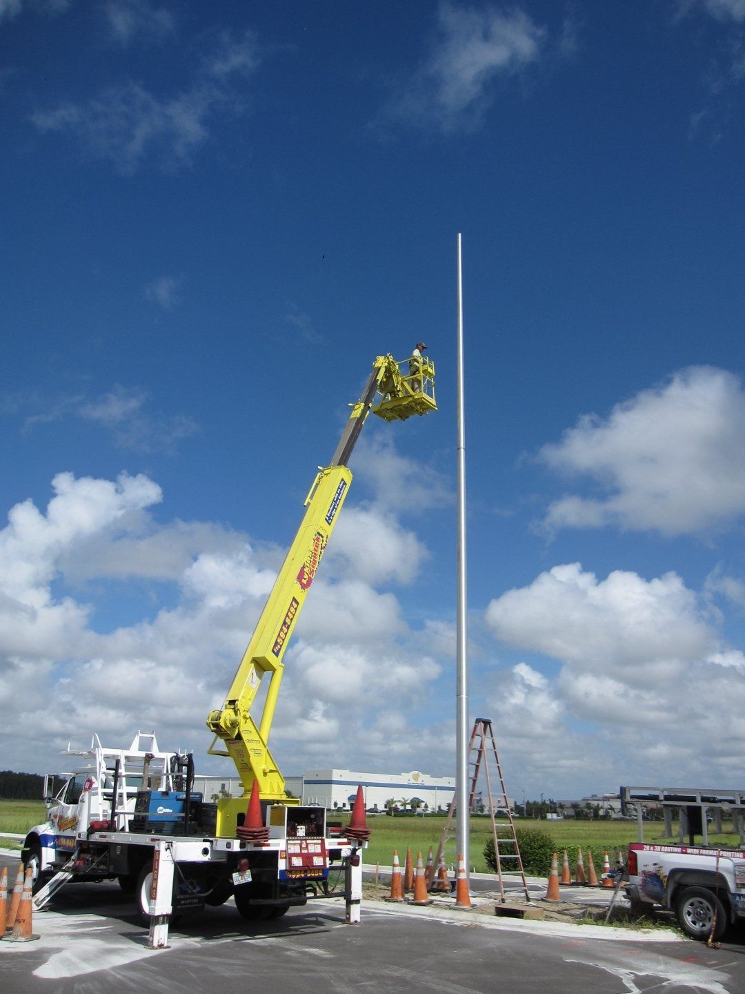 A yellow crane with the word astra on it