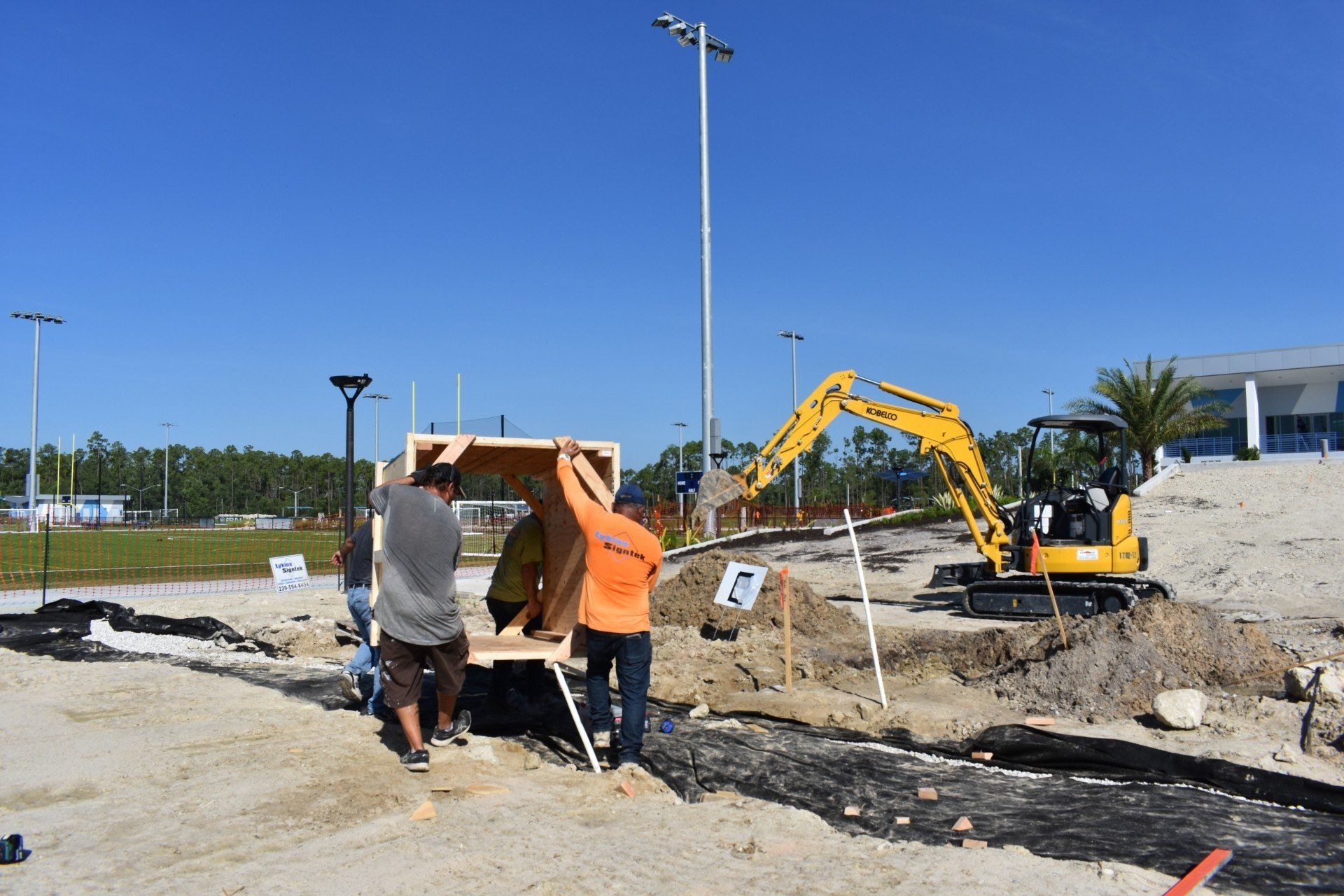 A group of construction workers are working on a construction site.