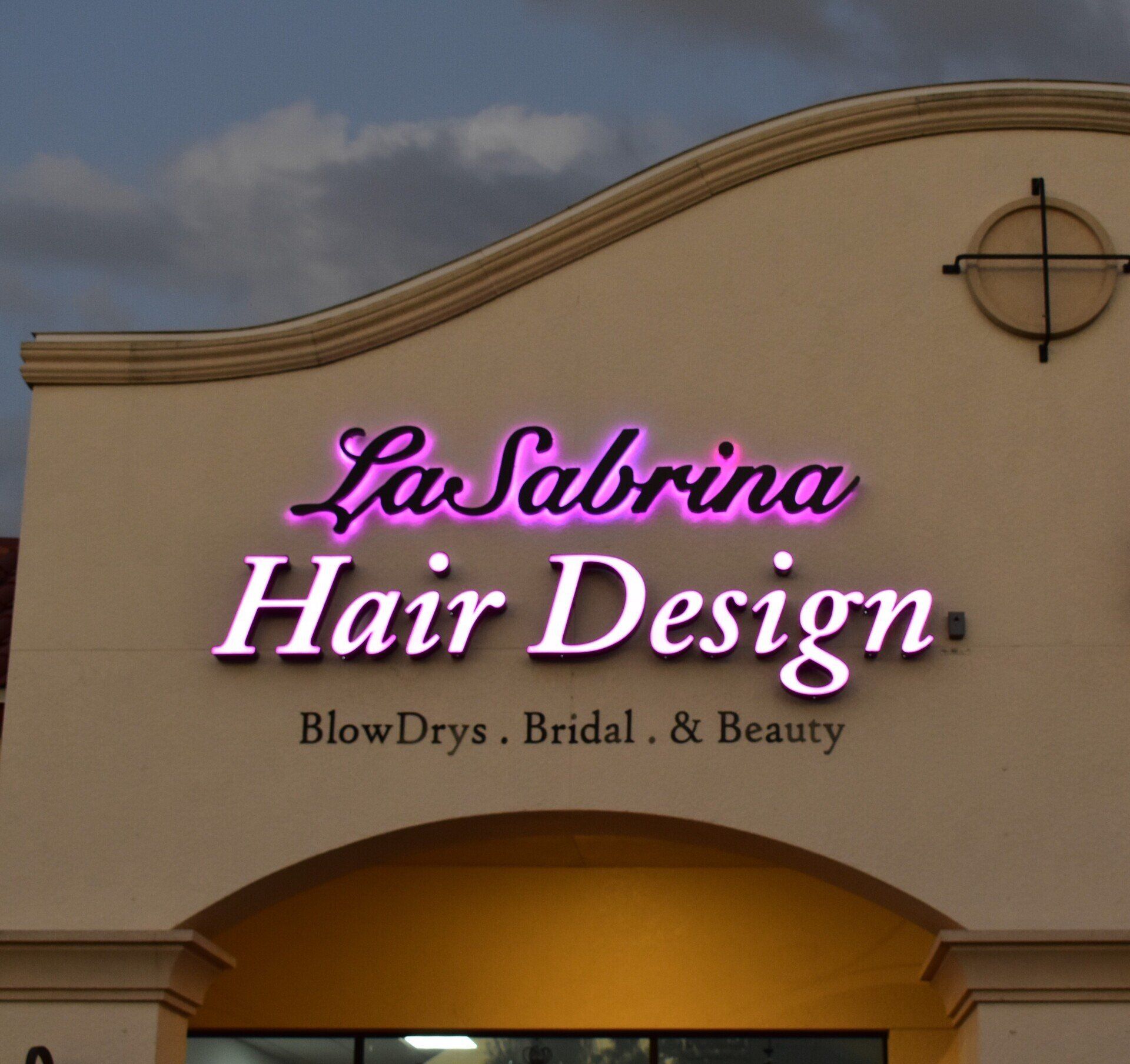 A sign for la sabrina hair design blow drys bridal and beauty