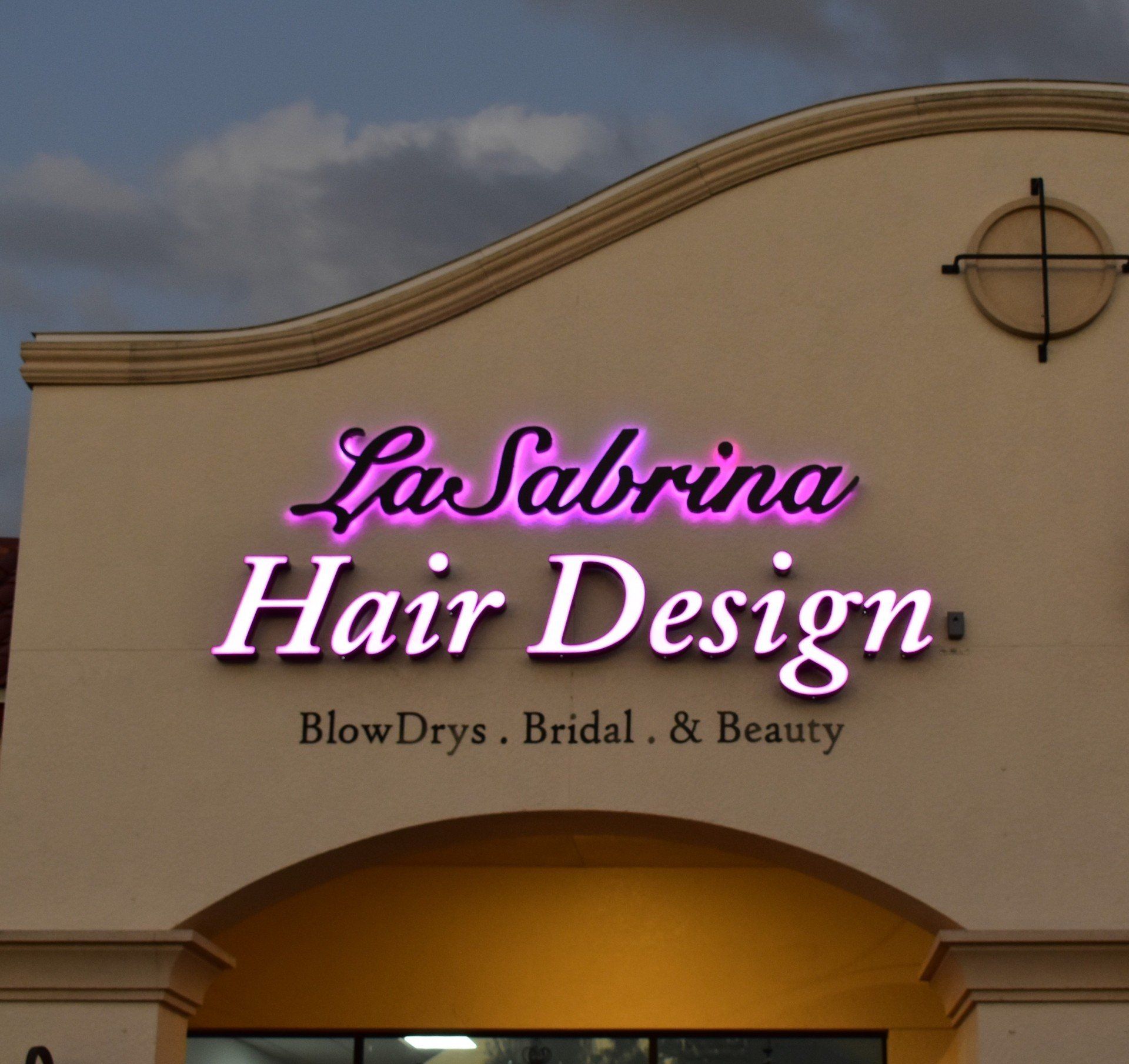 A sign for la sabrina hair design blow drys bridal and beauty