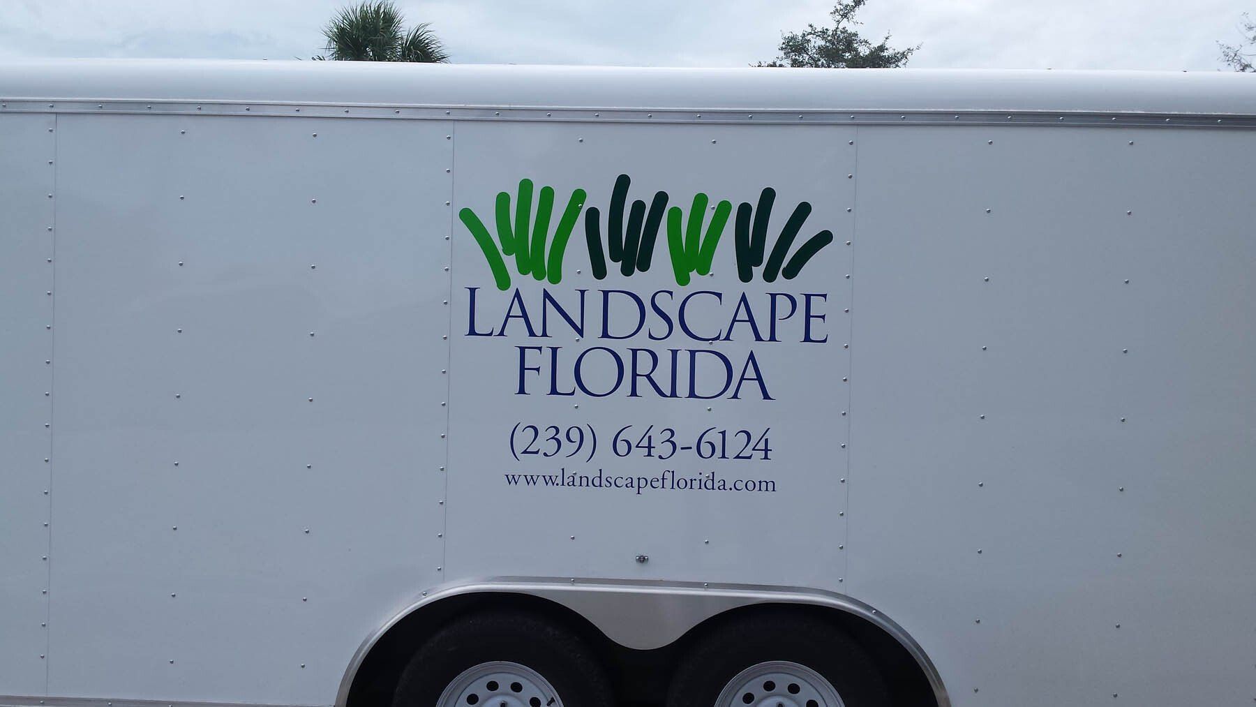 A white trailer with the words landscape florida on it