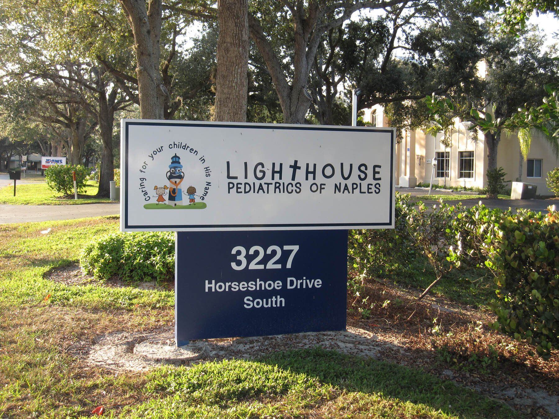 A sign for the lighthouse pediatrics of naples