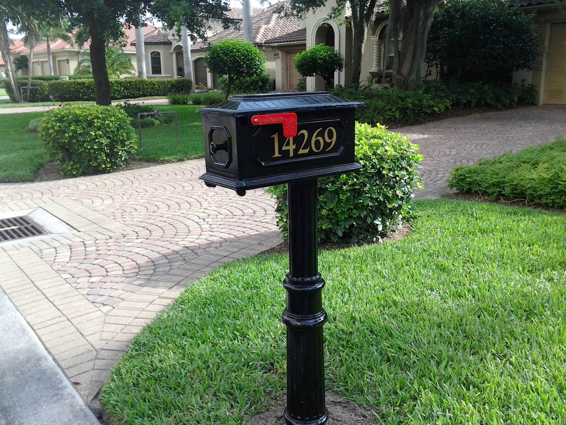 A black mailbox with the address 14269 on it