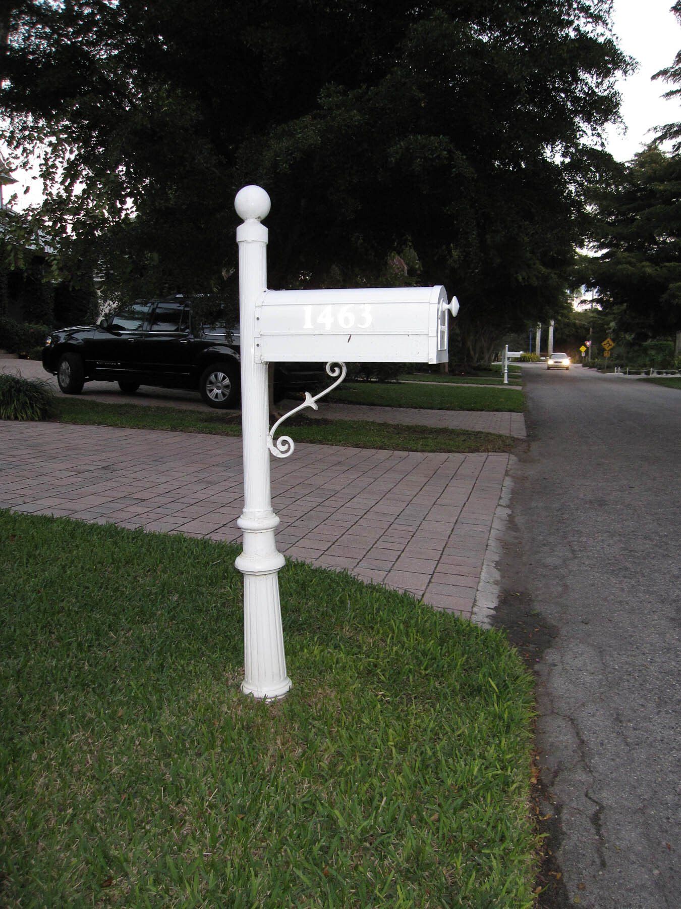 A white mailbox with the number 1441 on it