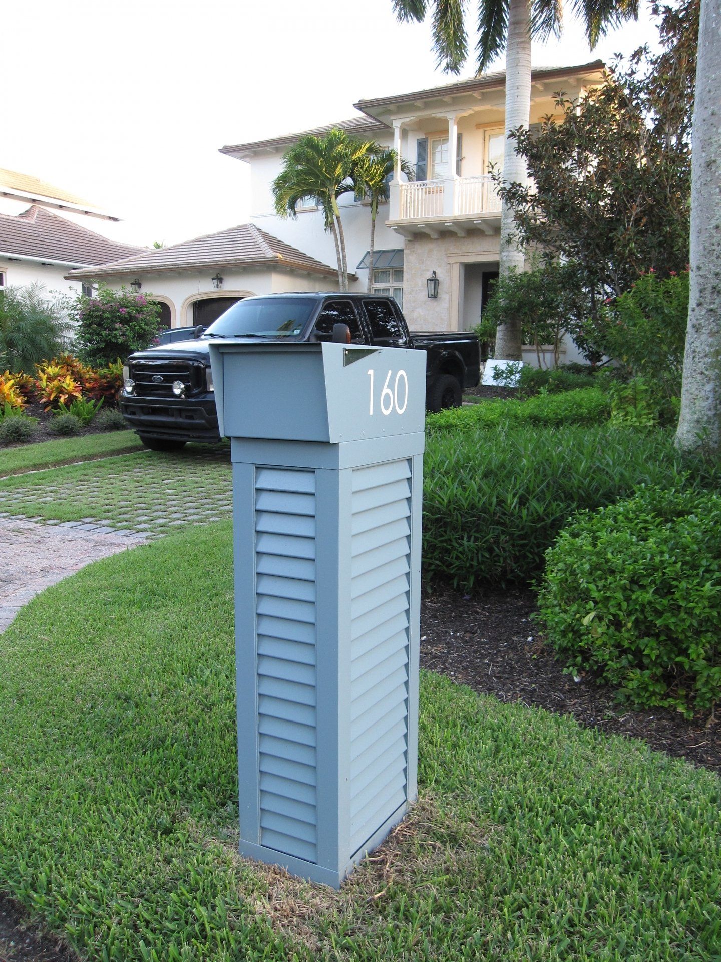 A mailbox with the number 160 on it
