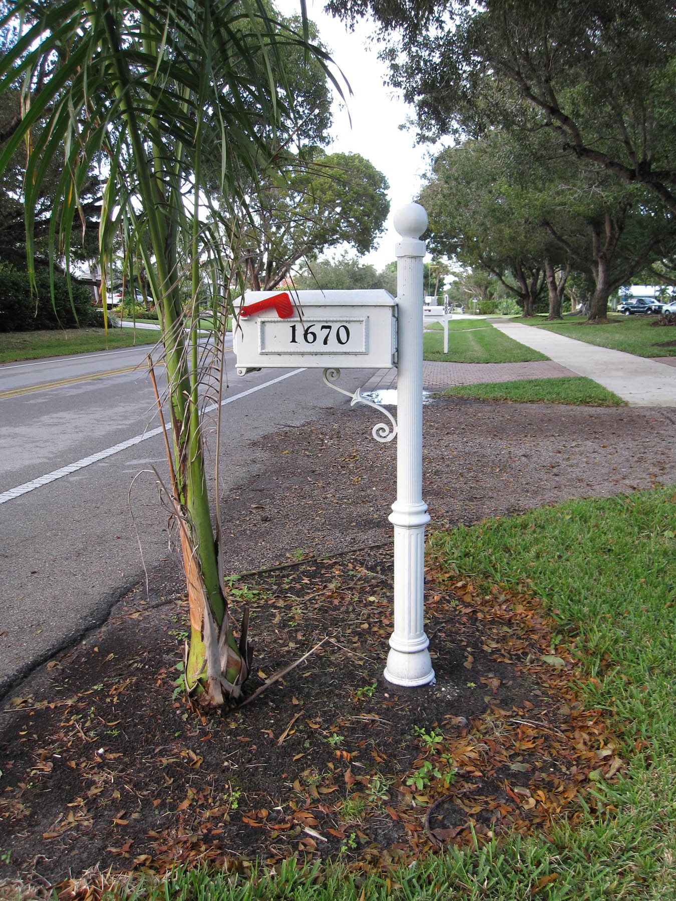 A white mailbox with the number 1670 on it