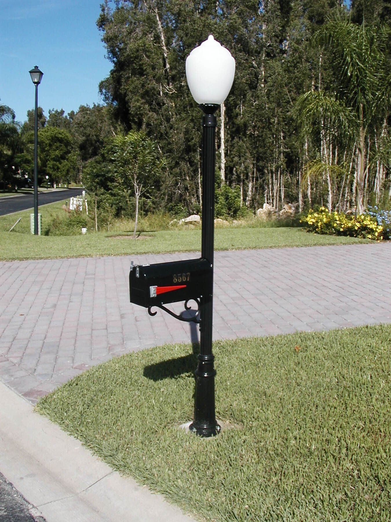 A black mailbox with a red arrow pointing to the right